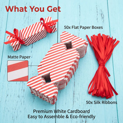 Festive candy shaped paper favor box displayed on table with holiday decor and treat sachet